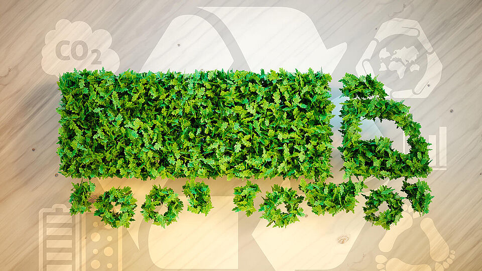 Grafische Abbildung eines LKWs aus Graselementen als Bezug zum nachhaltigen Aspekt bzgl. der Lieferkette.